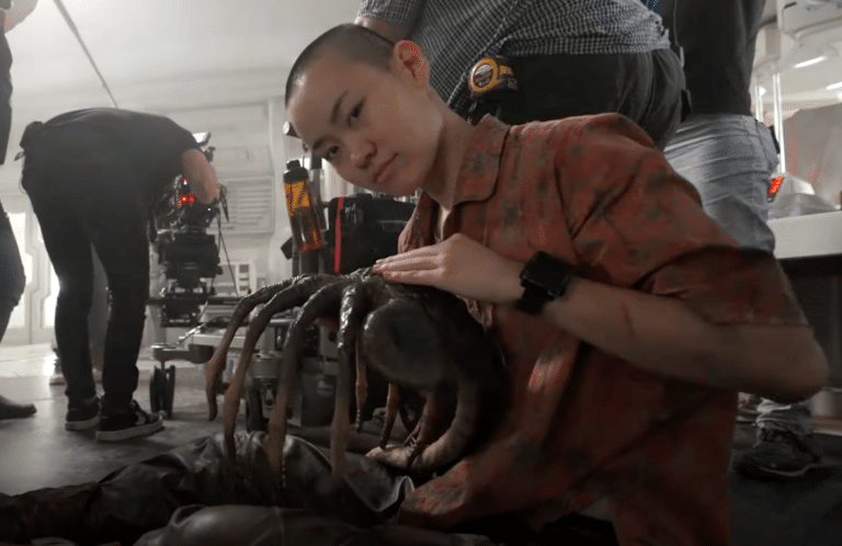 Aileen Wu gets up close and personal with a Facehugger in ALIEN: ROMULUS