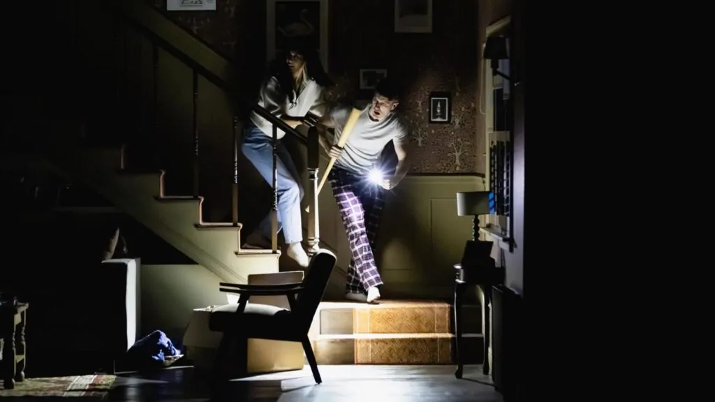 Cher Álvarez and Patrick Heusinger in PARANORMAL ACTIVITY (Credit: Kyle Flubacker)