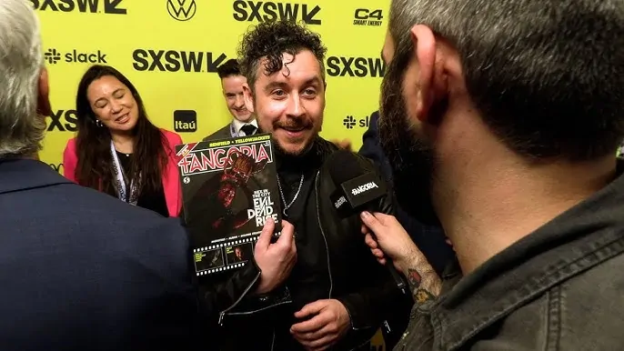 Lee Cronin recieves his EVIL DEAD RISE cover issue of FANGORIA at SXSW 2023 (Credit: Jason Kauzlarich)